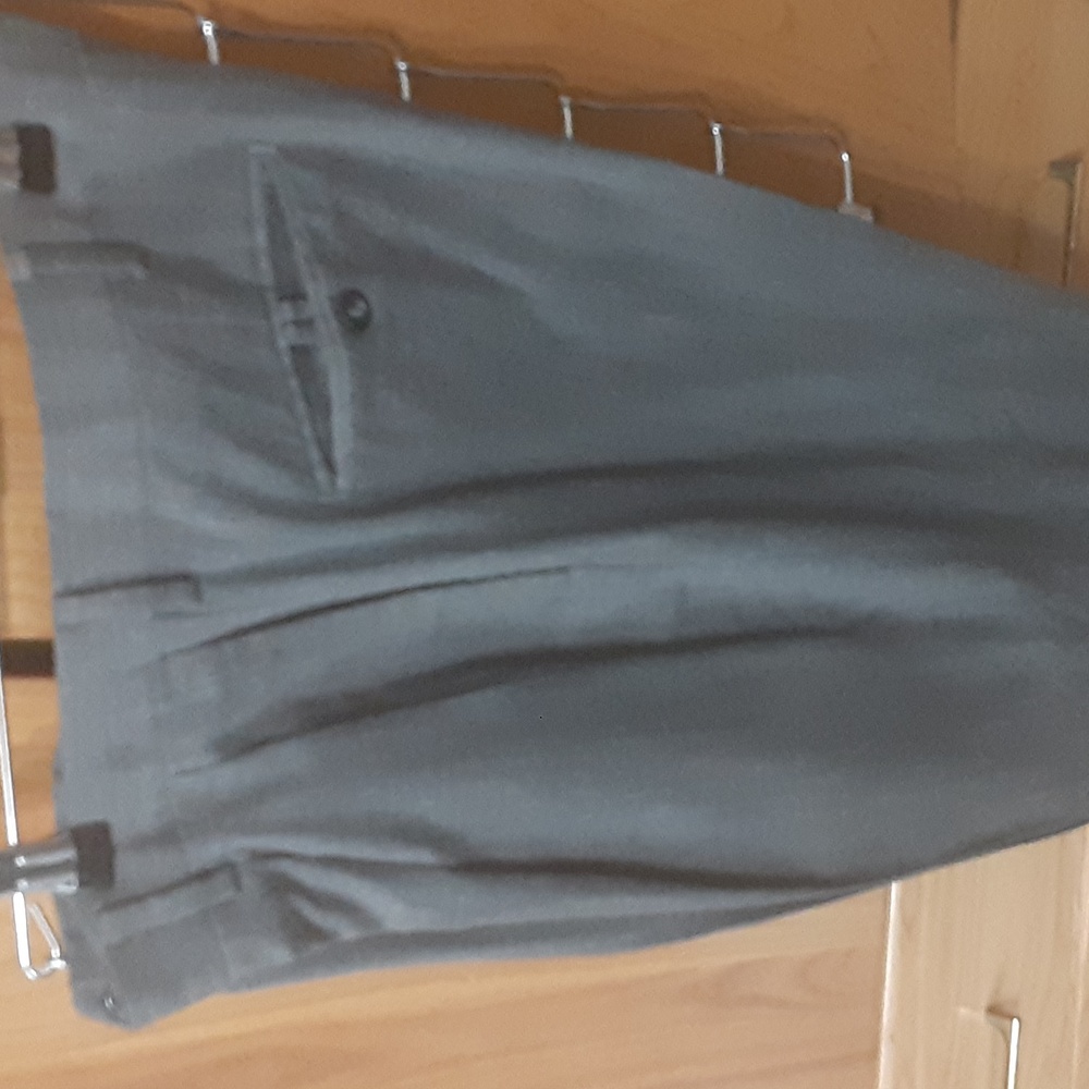 A grey pair of dress slacks made by dockers size 34/34
